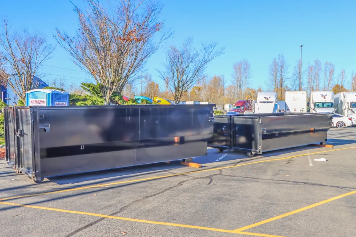 Professional dumpster rental service with roll-off container on residential driveway in Milwaukee